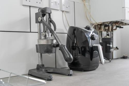 a machine sitting on a counter next to a appliance at The Sheriff's Den in Nottingham