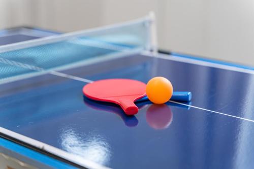 a ping pong ball and a paddle on a table at The Sheriff's Den in Nottingham