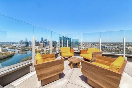 a living room with furniture and a view of the city at Frisco at the Rainey District in Austin