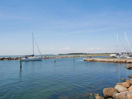a group of boats docked in a harbor at Charming Fisherman's Cottage - By Traum Ferienwohnungen in Borre