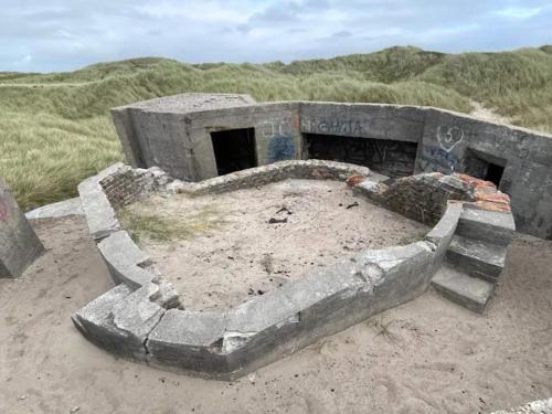a concrete bunker sitting on top of a sand field at 6 person holiday home in Thisted-By Traum in Torsted