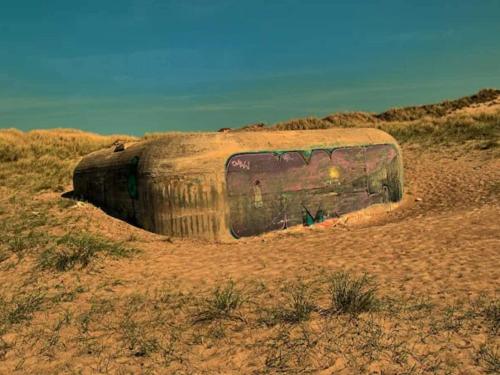 a bus sitting in the middle of a field at 6 person holiday home in Thisted-By Traum in Torsted