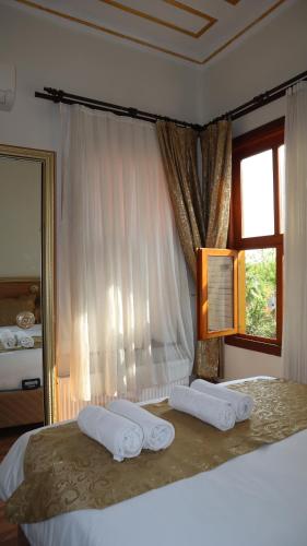 Postel nebo postele na pokoji v ubytování Blue Eye Suites