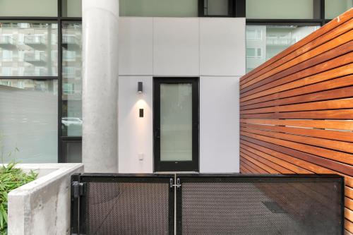 a facade of a building with a wooden fence at Urban Loft, Redmond Core - 92 Walkscore! in Redmond