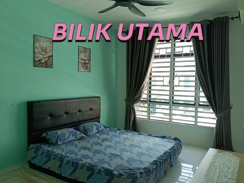 a bedroom with a bed and a large window at Homestay impian, arau in Arau