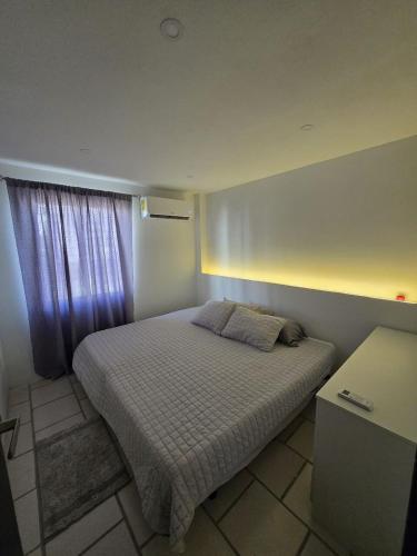Katil atau katil-katil dalam bilik di Latitud Suites