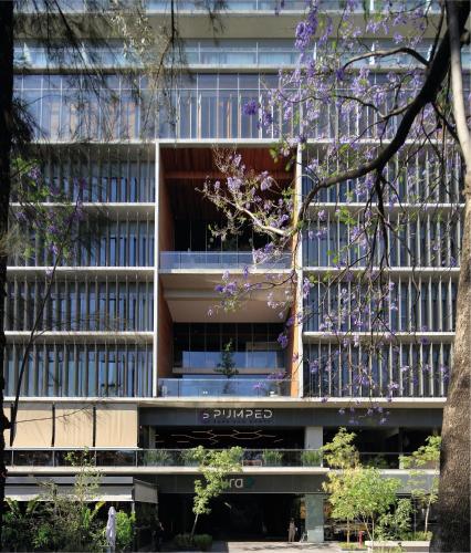 a building with a porsche sign in front of it at voco Guadalajara Neruda by IHG in Guadalajara