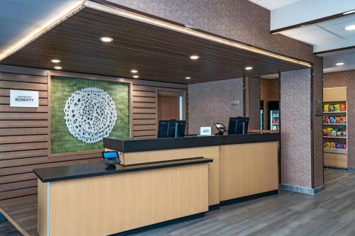 a lobby of a hospital with a reception counter at Fairfield by Marriott Inn & Suites Phoenix West Chandler in Phoenix