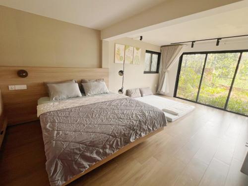 Ένα ή περισσότερα κρεβάτια σε δωμάτιο στο Casa Rosa Homestay