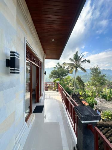 a balcony of a house with a view at Merta House Sidemen in Sidemen