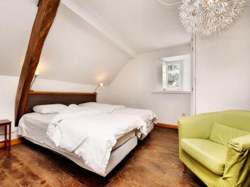 a bedroom with a bed and a couch at Group Retreat in Robertville in Robertville