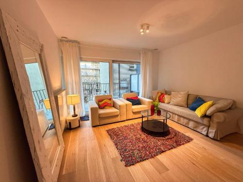 a living room with a couch and a table at Brussels City Apartment in Brussels