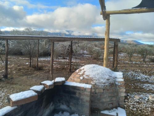 a brick oven with snow on top of it at Casas de Epoca -Serendipia in Charbonier
