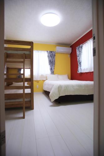 Guesthouse Yaggy 壱にあるベッド