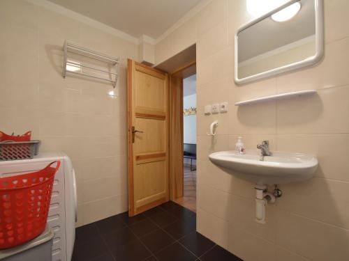 a bathroom with a sink and a mirror at Holiday Home Rudník near Ski Lift in Javorník