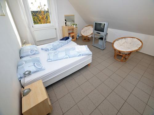 a bedroom with a bed and a tv in it at Villa in Nemojov near Giant Mountains in Nemojov