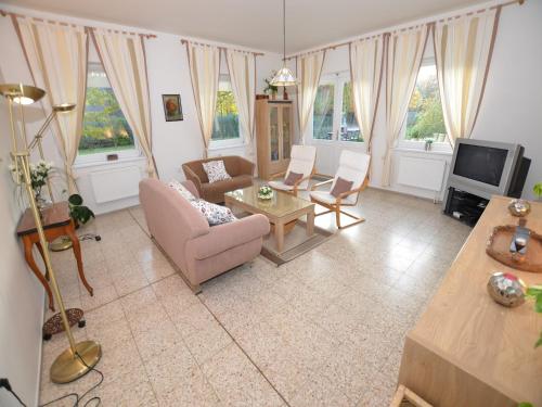 a living room with a couch and a tv at Villa in Nemojov near Giant Mountains in Nemojov