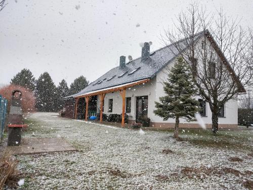 a house with snow on the roof of it at Villa in Nemojov near Giant Mountains in Nemojov