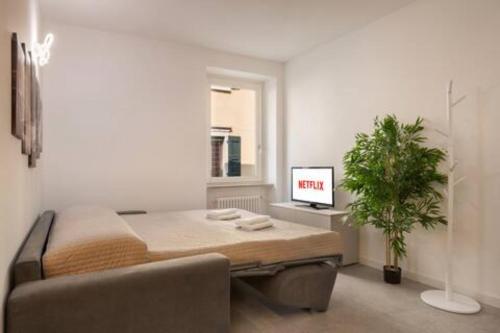 a living room with a couch and a table at Suite Diamante Luxury Apartment - Center - Lake in Torri del Benaco