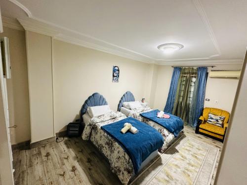 Ein Bett oder Betten in einem Zimmer der Unterkunft Queen of the pyramids hotel
