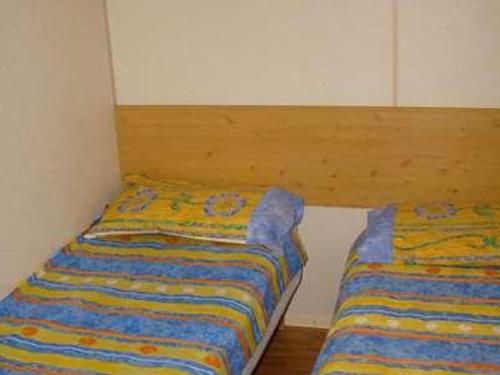 Postel nebo postele na pokoji v ubytování Mobil home 26m² avec Terrasse - 4 personnes - API-1-52-339