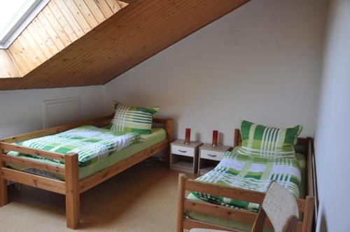 Ένα ή περισσότερα κρεβάτια σε δωμάτιο στο Ferienwohnung Landidyll