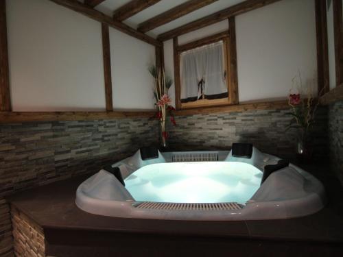 a large bath tub sitting in a room at Holiday Home in Caldes near Ski Lift in Caldes