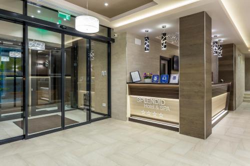 a store front with glass doors in a building at New Splendid Hotel & Spa - Adults Only (+16) in Mamaia