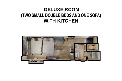 two small double beds and one sofa in a small apartment at goom Hotel Nakasu in Fukuoka