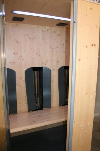a shelf in a baseball dugout with wooden walls at Hotel garni Almenrausch und Edelweiss in Garmisch-Partenkirchen