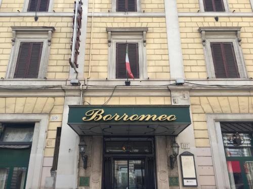 
a building with a sign on the front of it at Hotel Borromeo in Rome

