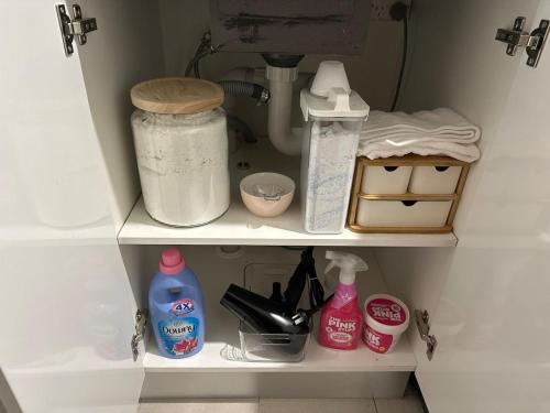 a kitchen shelf with some food items on it at 4BR Home 10 mins walk to UOW, free parking, Wi-Fi, AC in Keiraville