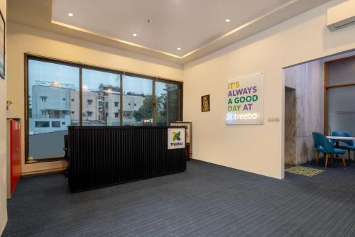 a waiting room with a sign that says the always a good day at at Treebo Terrazzo Suites in Ahmedabad