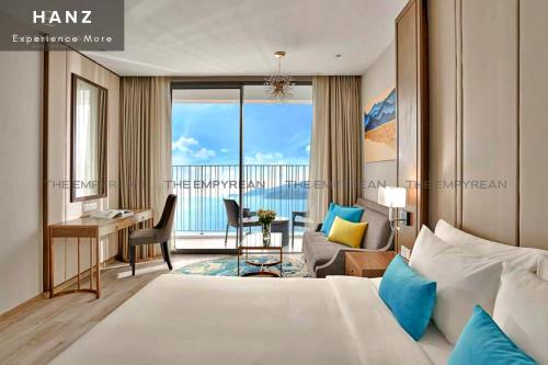a hotel room with a bed and a desk and a room at S79 Residence LYN Panorama in Nha Trang
