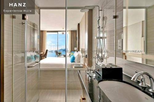 a bathroom with a sink and a master bedroom at S79 Residence LYN Panorama in Nha Trang