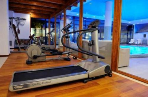 a gym with two exercise bikes in a room at Grand Hotel la Chiusa di Chietri in Alberobello