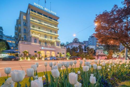 a bunch of white tulips in front of a building at Best Western Hotel Bellevue au Lac in Lugano