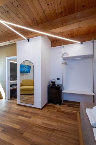 a bedroom with a mirror and a bed at The Crispi House in Vasto