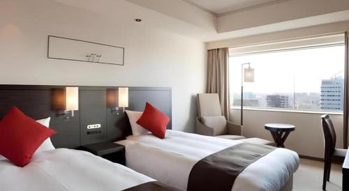 Un ou plusieurs lits dans un hébergement de l'établissement Century Royal Hotel Sapporo
