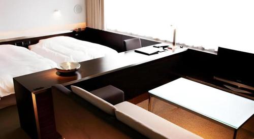 Un ou plusieurs lits dans un hébergement de l'établissement Century Royal Hotel Sapporo