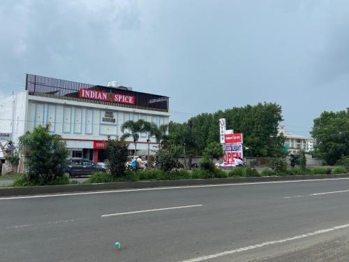 an empty street in front of a building at HOTEL U TURN BY Nexottel in Indore
