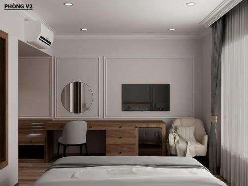 a bedroom with a bed and a tv on the wall at Villa Oasis in Luang Prabang