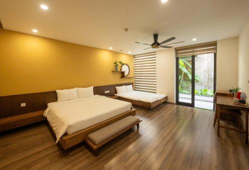 Postel nebo postele na pokoji v ubytování Navilla Huế Homestay