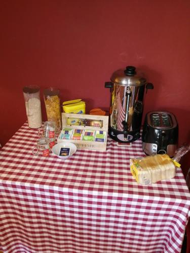 a table with a tea pot and food on it at "Altjessen 57" in Pirna