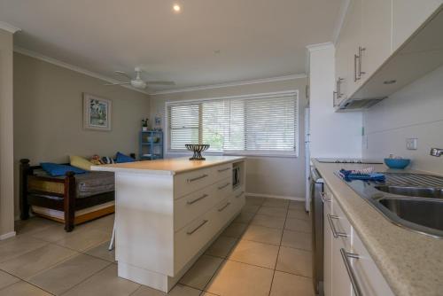 a kitchen with a sink and a counter top at Pandanus Palms Holiday Resort in Point Lookout