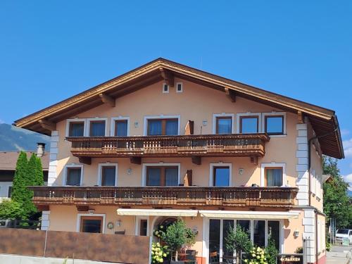 a building with balconies on the side of it at Apart Andrea in Uderns