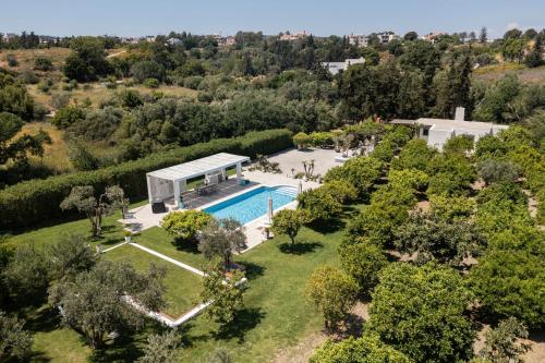 an aerial view of a villa with a swimming pool at Antigone Estate in Koskinou