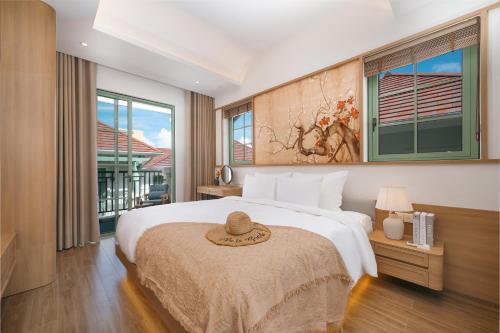 Кровать или кровати в номере Elyday Villa - Bai Khem Beach, Phu Quoc
