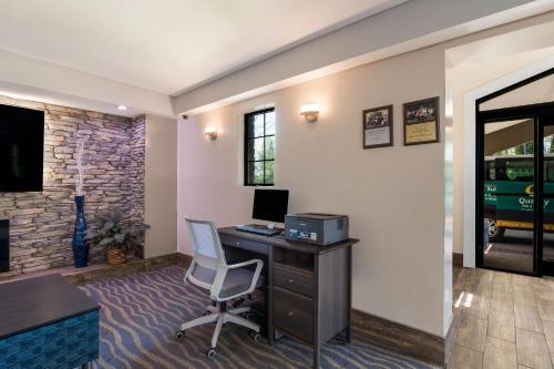 an office with a desk with a computer and a chair at Quality Inn & Suites Airport in Charlotte