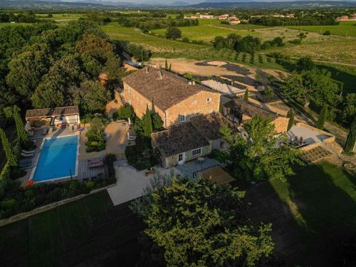 an aerial view of a house with a swimming pool at Gite Monet in Bouchet